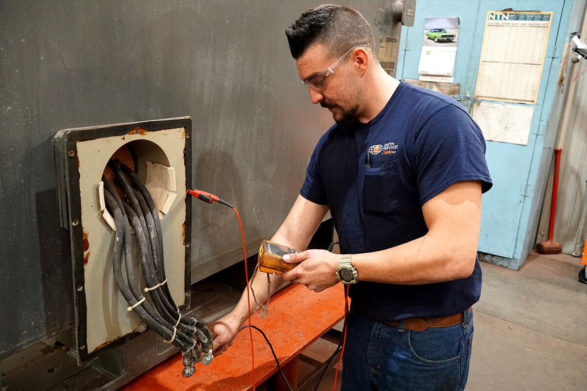 Smith Services technician rewiring motor