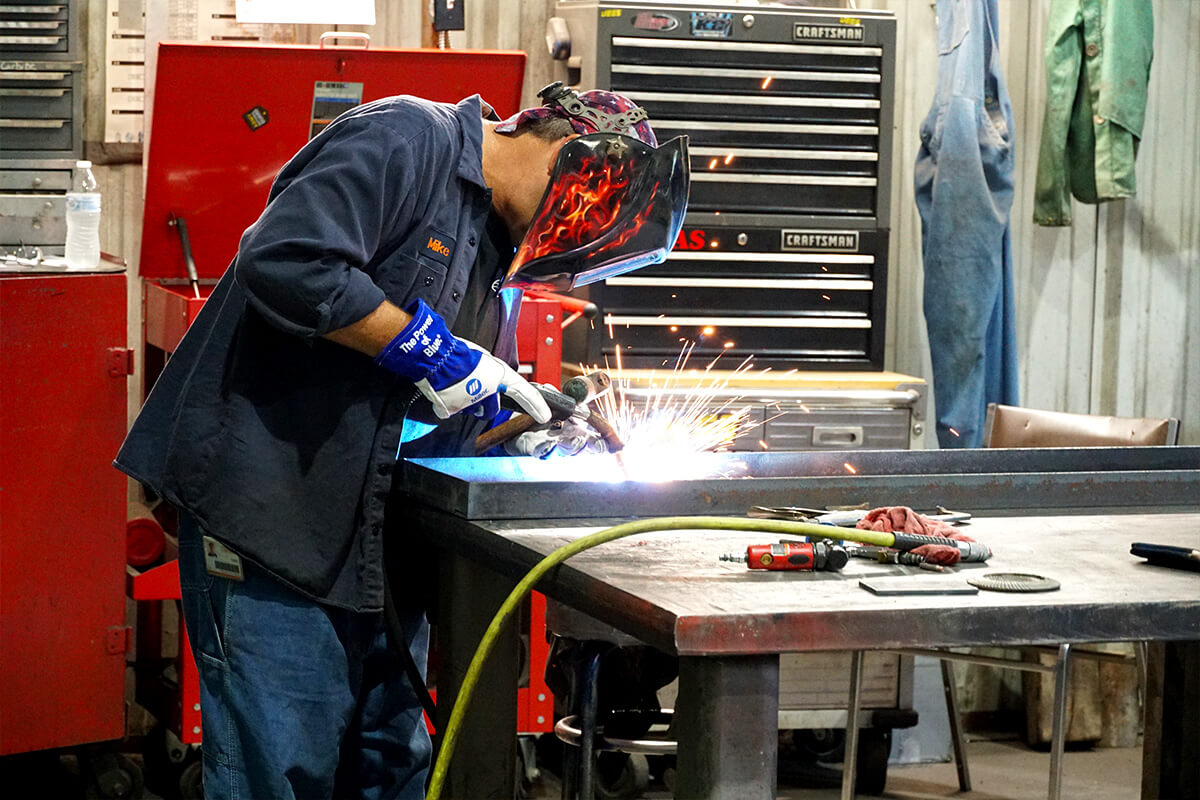 Smith Services technician welding for a motor repair