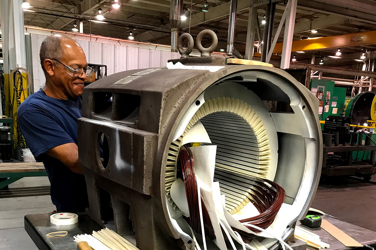 Motor technician working on strator motor