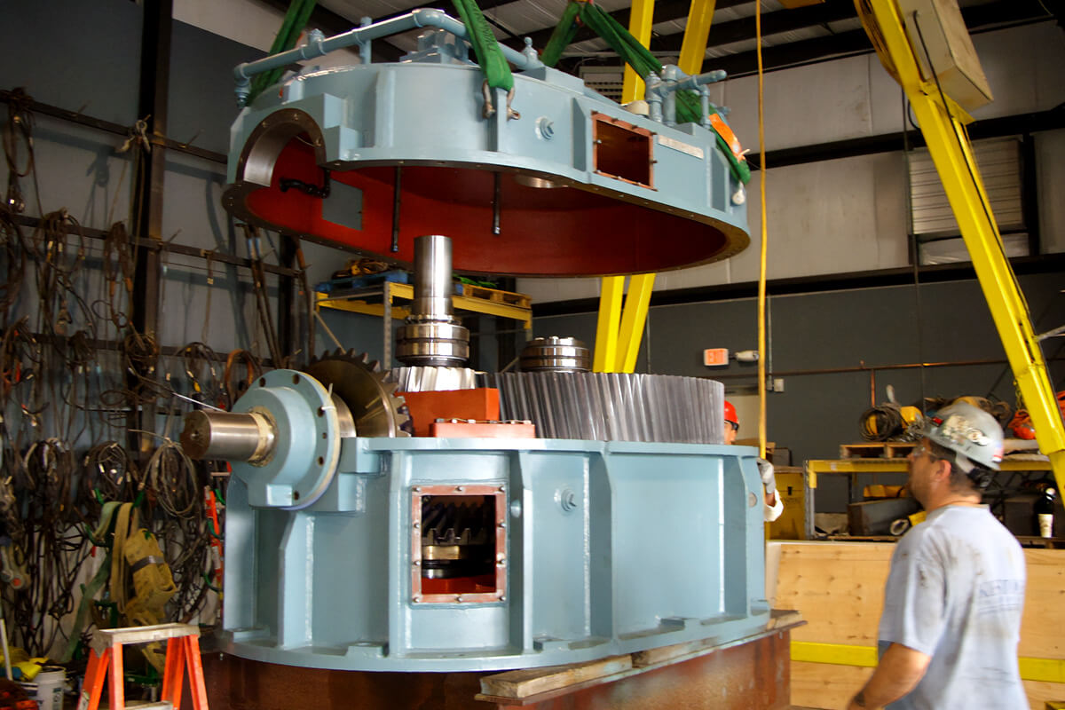 Technician inspecting gearbox onsite based out of Smith Services facility in West Virginia