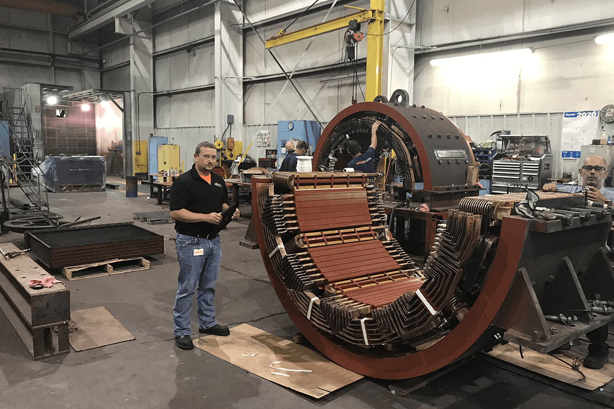 Smith Services engineer evaluating a stator for a generator repair and electric motor repair in our facility in Princeton, WV.
