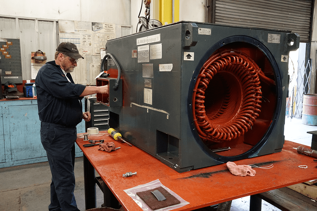 Smith Services technician working on an electric motor repair and getting it ready for Smith Services electric motor storage program.