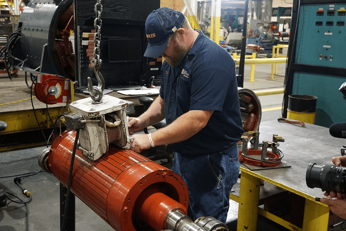Smith Services technician doing a repair on an electric motor rotor for a complete electric motor repair and generator repair.