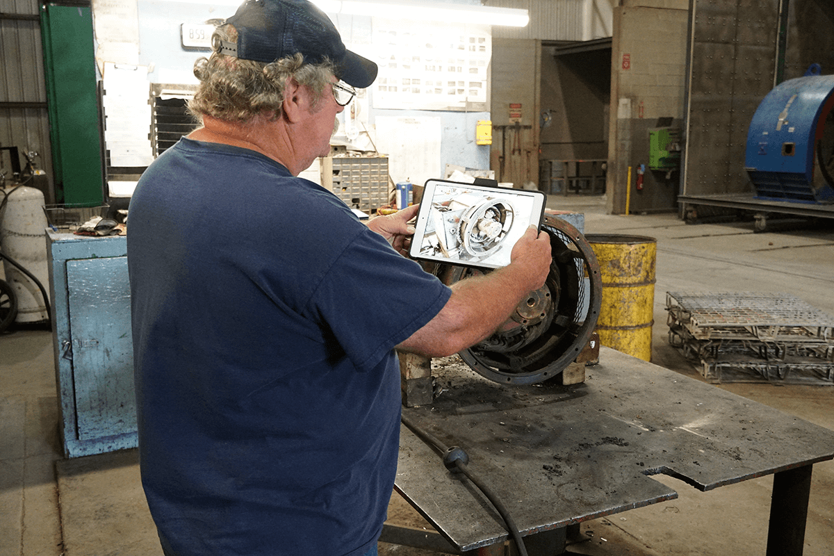 Smith Services technicians performing an incoming inspection on an electric motor for an electric motor repair. The same procedure is done for generator repairs.